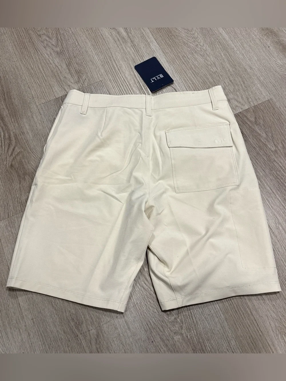 BYLT Basics Shorts Mens 32 Bone Tan Kinetic Stretch Zip Pocket Flat Front NWT